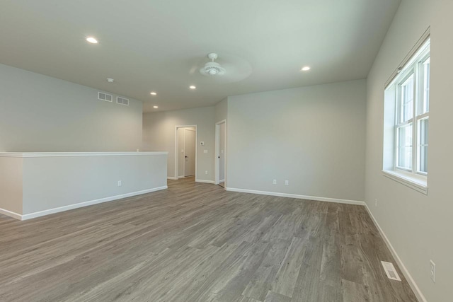 unfurnished room with light hardwood / wood-style floors