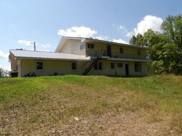 back of house with a yard