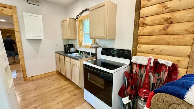 kitchen featuring light wood-type flooring, light brown cabinets, sink, and white range with electric stovetop