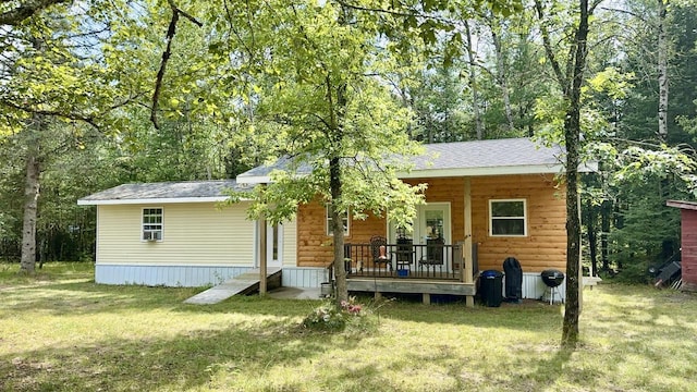 rear view of house with a lawn