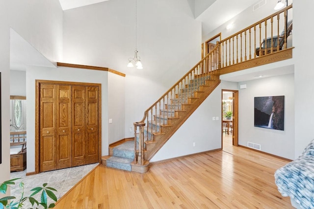 S2916A Fairway Dr, Reedsburg, WI 53959 - entrance foyer with hardwood / wood-style floors, a notable chandelier, and a high ceiling