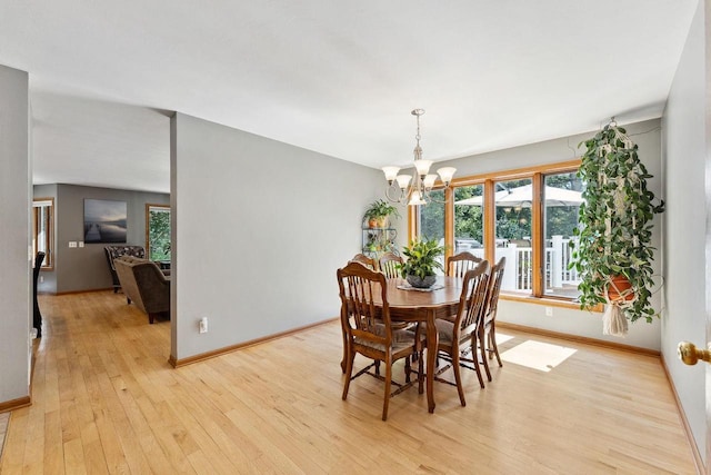 S2916A Fairway Dr, Reedsburg, WI 53959 - dining room featuring an inviting chandelier and light hardwood / wood-style flooring