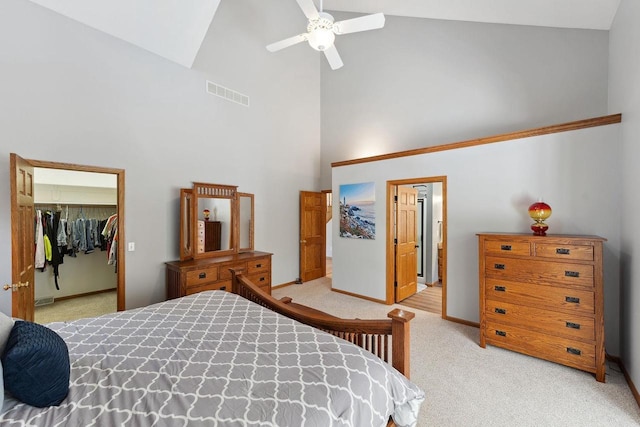 S2916A Fairway Dr, Reedsburg, WI 53959 - carpeted bedroom with high vaulted ceiling, a closet, a walk in closet, and ceiling fan