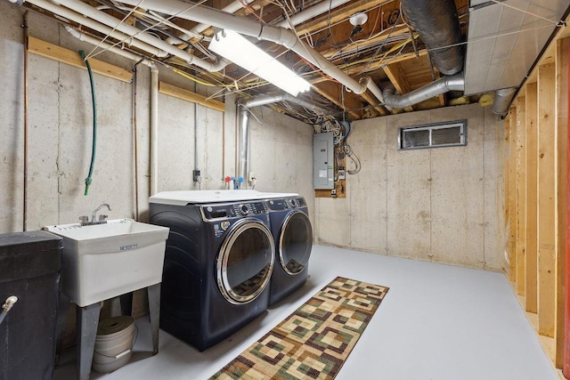 S2916A Fairway Dr, Reedsburg, WI 53959 - washroom with electric panel and washer and clothes dryer
