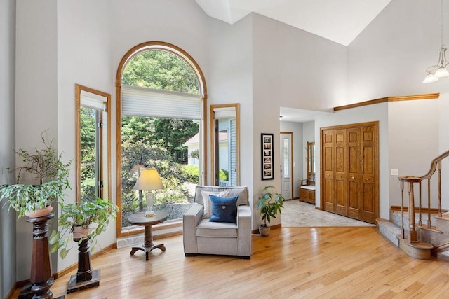 S2916A Fairway Dr, Reedsburg, WI 53959 - entryway featuring high vaulted ceiling, light hardwood / wood-style flooring, and a notable chandelier