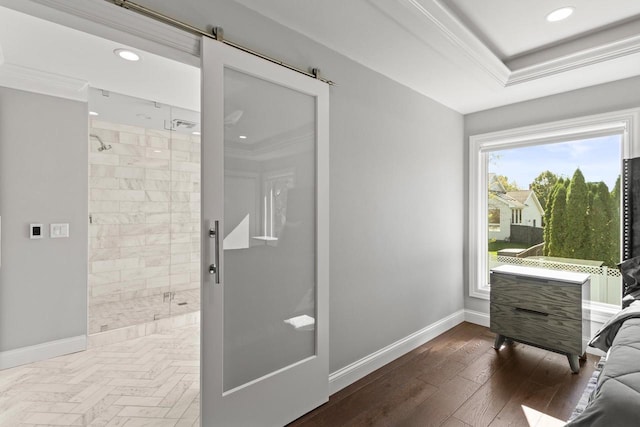 bathroom featuring tiled shower, ornamental molding, and hardwood / wood-style floors