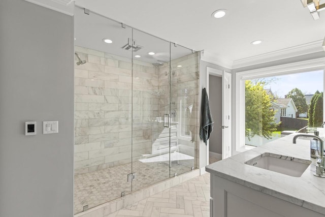 bathroom with walk in shower, vanity, parquet flooring, and ornamental molding