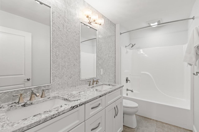 full bathroom with decorative backsplash, vanity, shower / bathtub combination, toilet, and tile patterned floors