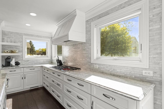 kitchen featuring white cabinetry, stainless steel gas cooktop, dark hardwood / wood-style floors, and a wealth of natural light