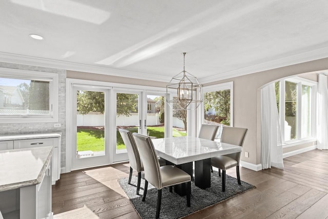 sunroom featuring a notable chandelier and a healthy amount of sunlight