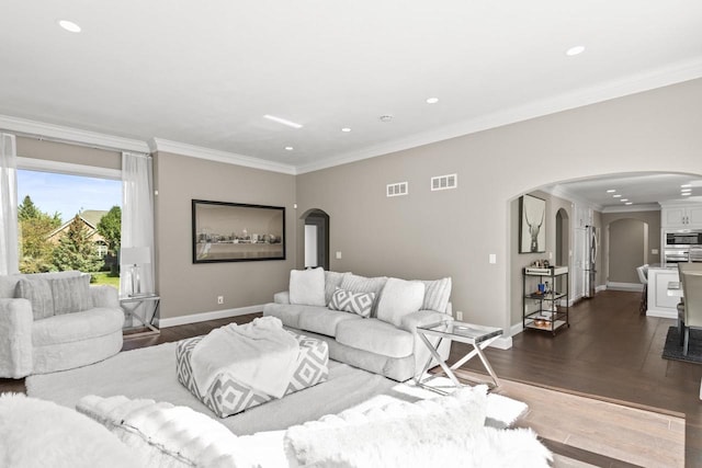 living room featuring ornamental molding and dark wood-type flooring