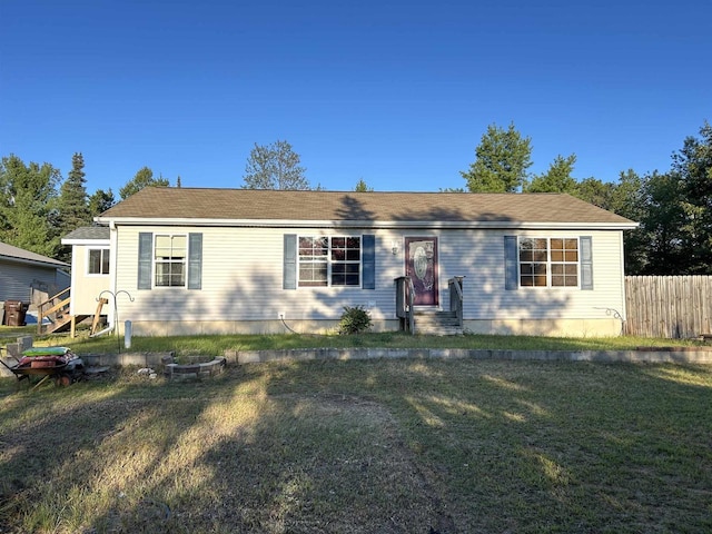 single story home with a front lawn