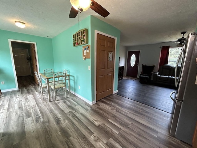 interior space featuring a textured ceiling and hardwood / wood-style flooring