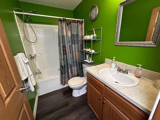 full bathroom featuring hardwood / wood-style flooring, toilet, shower / tub combo with curtain, and vanity