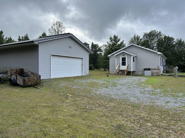 garage with a yard