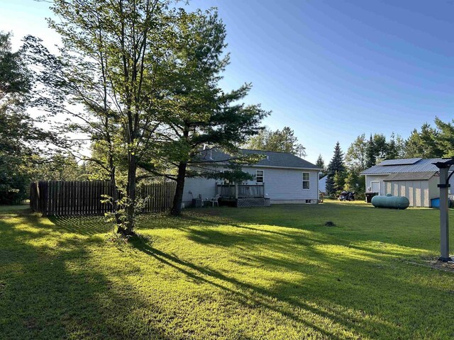 view of yard featuring a wooden deck