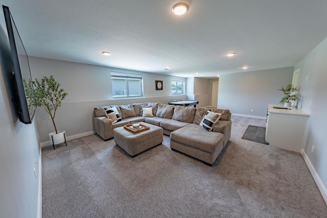 carpeted living room with sink