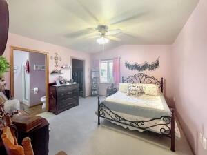 bedroom featuring ceiling fan and lofted ceiling