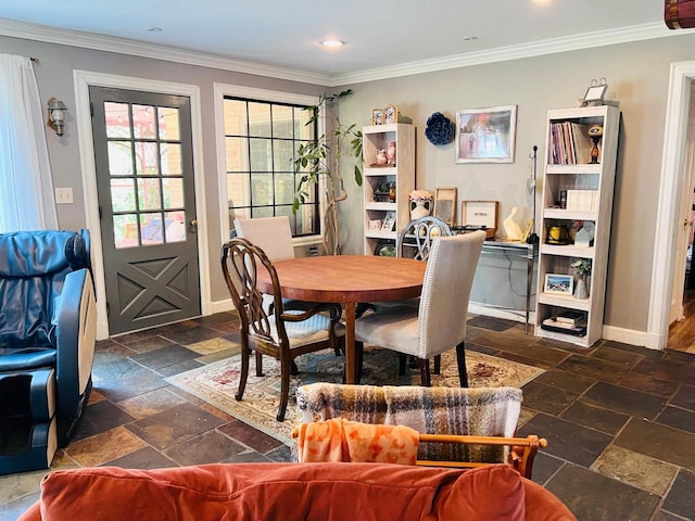 dining space with crown molding