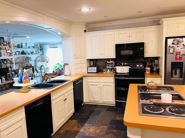 kitchen featuring sink, white cabinetry, crown molding, black appliances, and tasteful backsplash