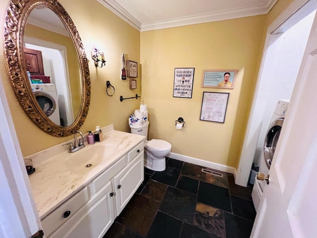 bathroom featuring washer / clothes dryer, vanity, crown molding, and toilet