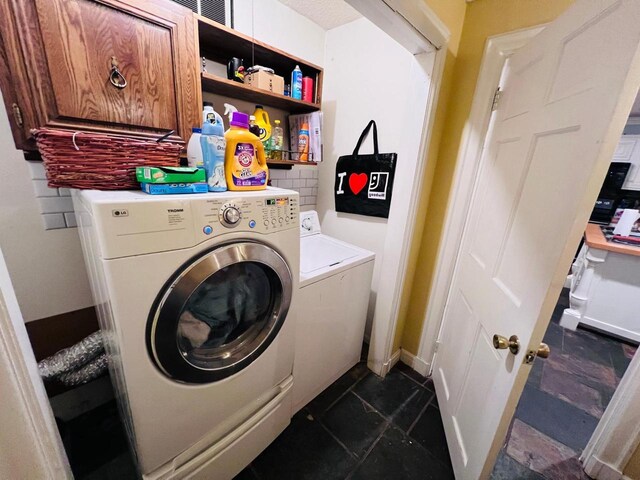 washroom with cabinets and independent washer and dryer