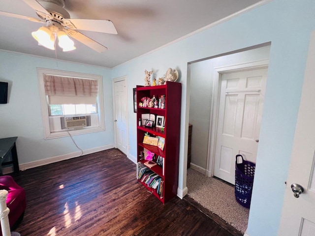 interior space with dark hardwood / wood-style flooring, ceiling fan, crown molding, and cooling unit