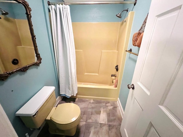 bathroom with tile patterned floors, toilet, and shower / bathtub combination with curtain