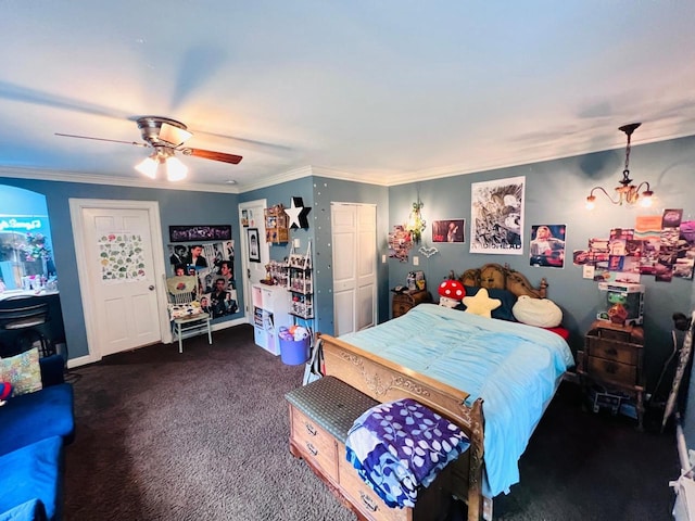 bedroom featuring dark colored carpet, crown molding, and ceiling fan