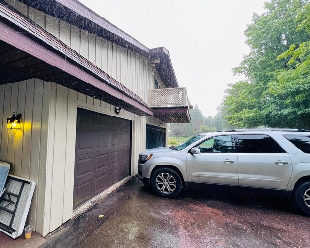 view of side of home with a garage