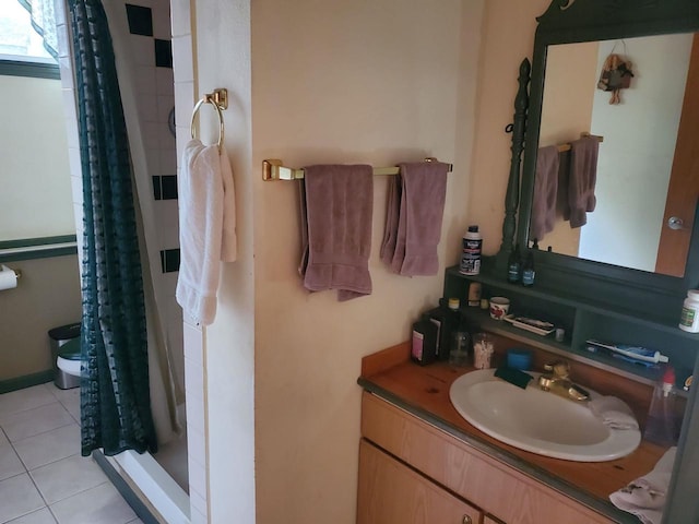 bathroom featuring vanity, curtained shower, toilet, and tile patterned flooring