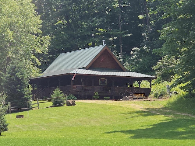 view of side of home featuring a yard