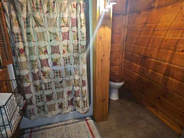 room details featuring hardwood / wood-style floors and a wood stove