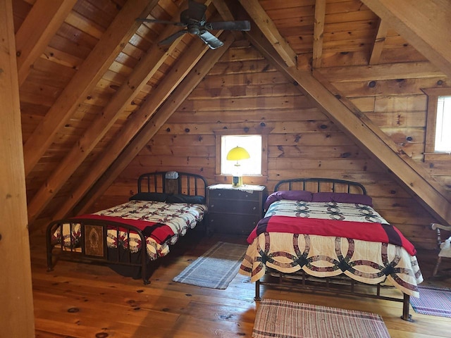 bedroom featuring hardwood / wood-style floors, wood walls, wooden ceiling, and lofted ceiling with beams