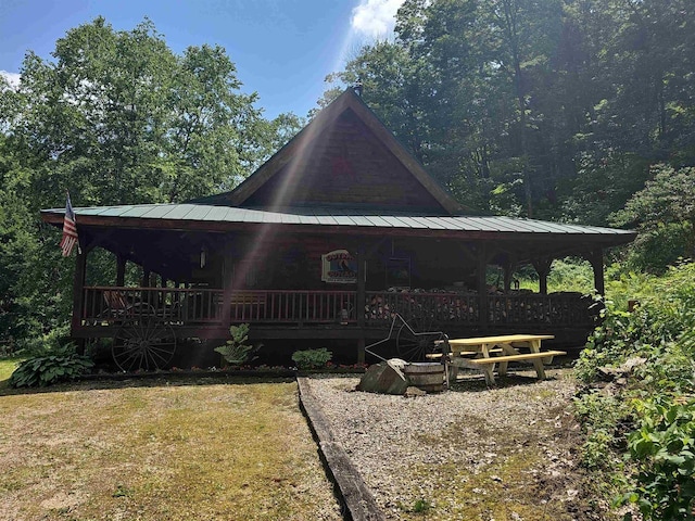 exterior space with a gazebo and a front yard