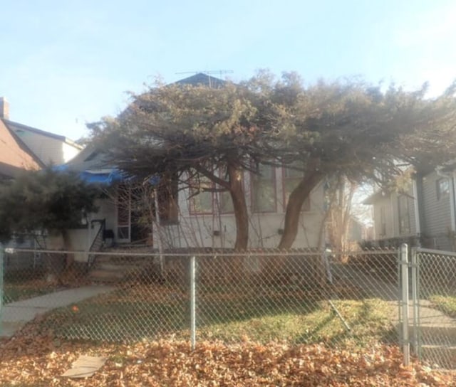 rear view of house with fence