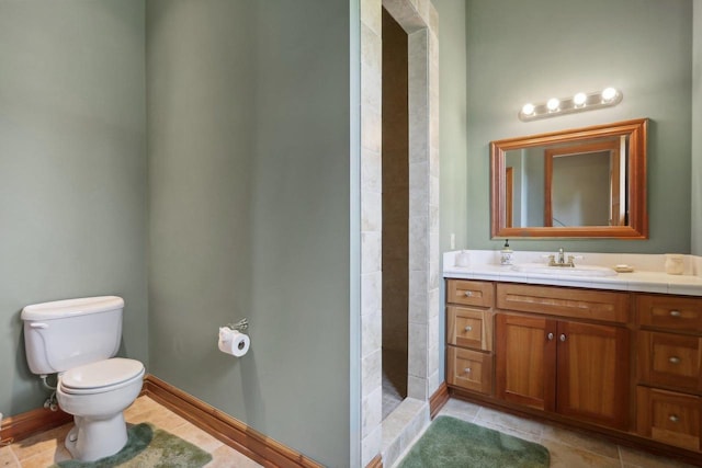 bathroom with tiled shower, toilet, tile patterned flooring, and vanity