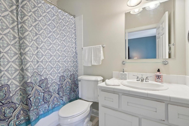 full bathroom featuring toilet, vanity, and shower / tub combo