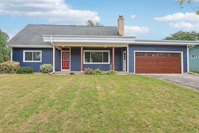 ranch-style house with a garage, a front yard, and covered porch