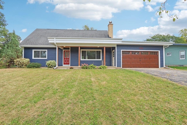 ranch-style home featuring a garage, a porch, and a front lawn