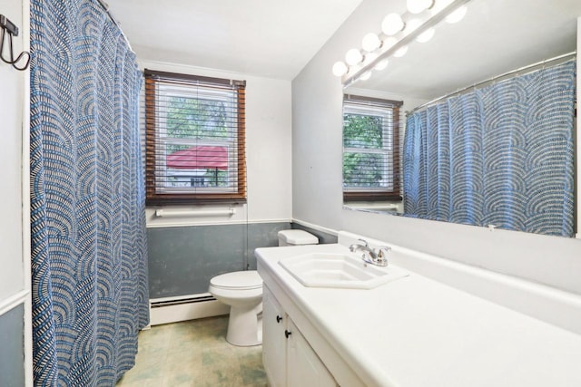 bathroom with vanity, toilet, and a baseboard heating unit