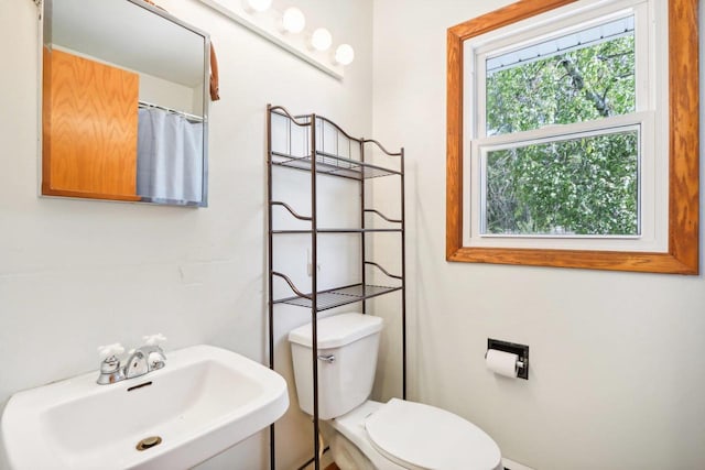 bathroom with sink and toilet