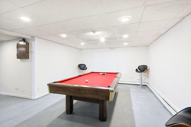 game room featuring a baseboard heating unit, pool table, concrete flooring, and a paneled ceiling