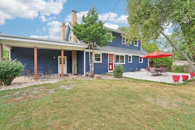 exterior space featuring a patio and a front lawn