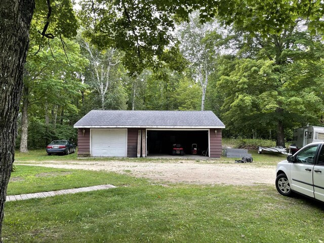 garage featuring a yard