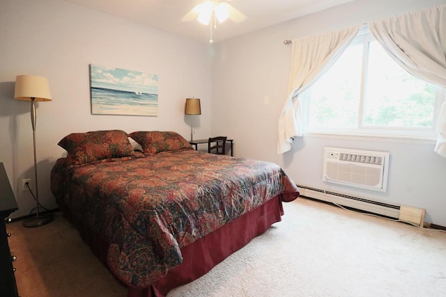 carpeted bedroom featuring an AC wall unit and a baseboard heating unit