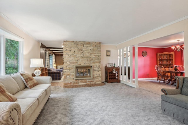 living room with a fireplace, ornamental molding, carpet, and a notable chandelier