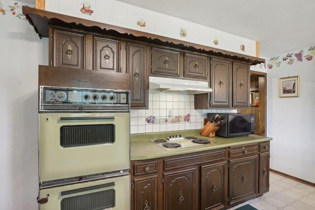 kitchen with double wall oven and dark brown cabinetry