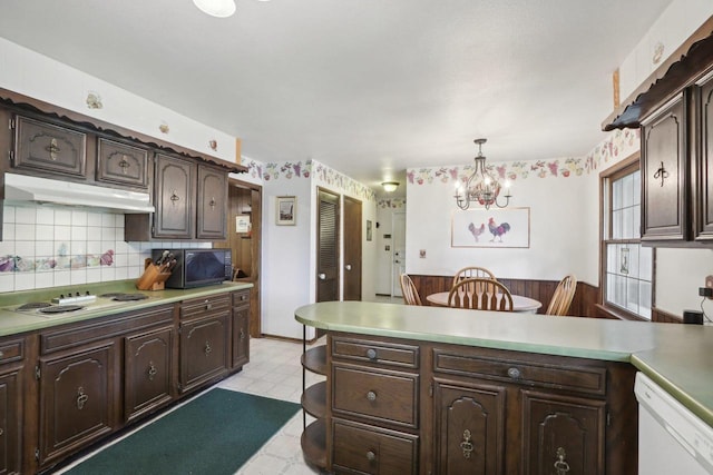 kitchen featuring white appliances, a chandelier, decorative light fixtures, dark brown cabinetry, and decorative backsplash