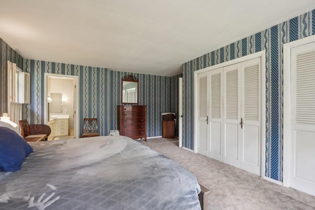 carpeted bedroom with connected bathroom